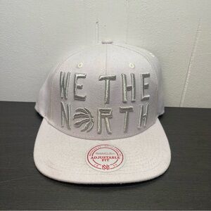 Mitchell & Ness NBA We The North, Toronto Raptors White Snapback Hat.